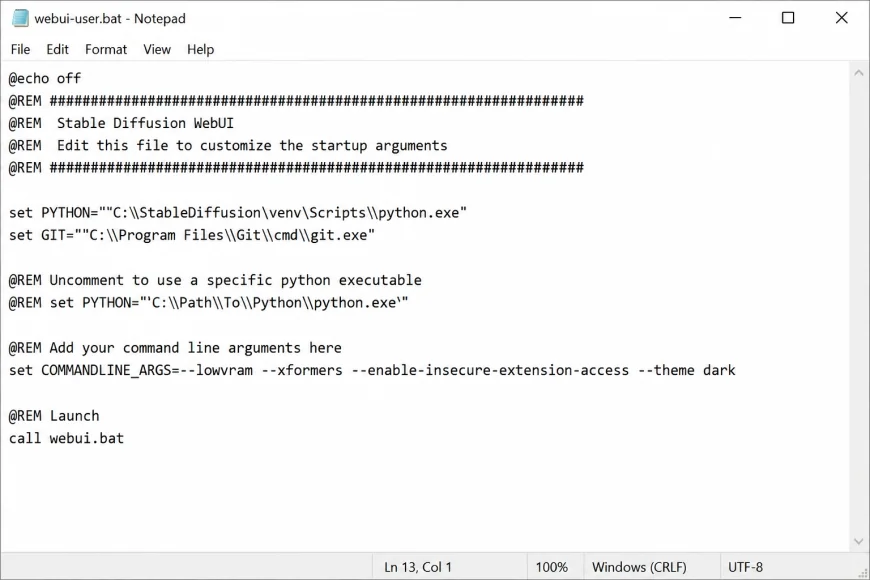 Screenshot of notepad editing the webui-user.bat file, showing the modified COMMANDLINE_ARGS line containing lowvram and xformers arguments